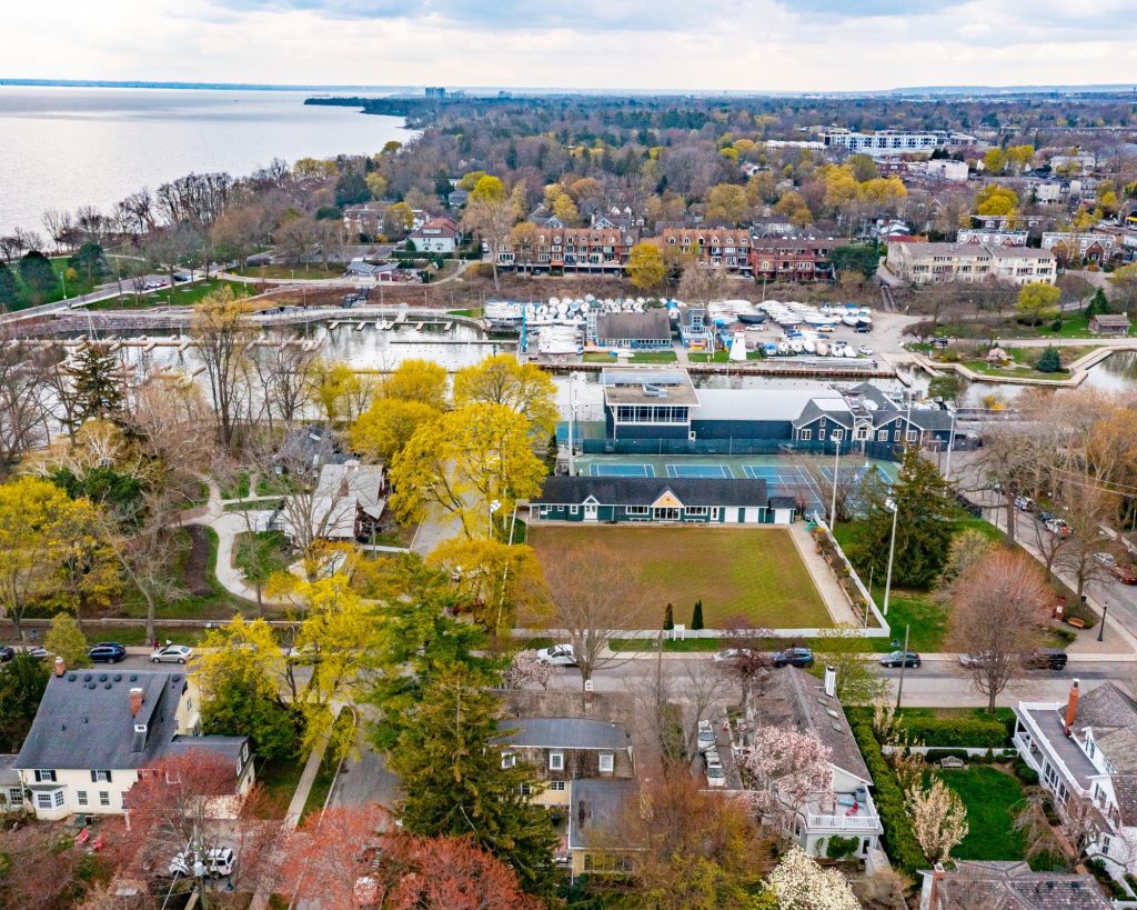 Aerial view of Lakeside Park in Oakville, featuring the Oakville Club's tennis courts near the lakefront.