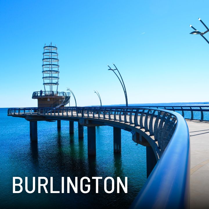 Brant Street Pier in Burlington, extending over Lake Ontario, showcasing its modern design and scenic views.