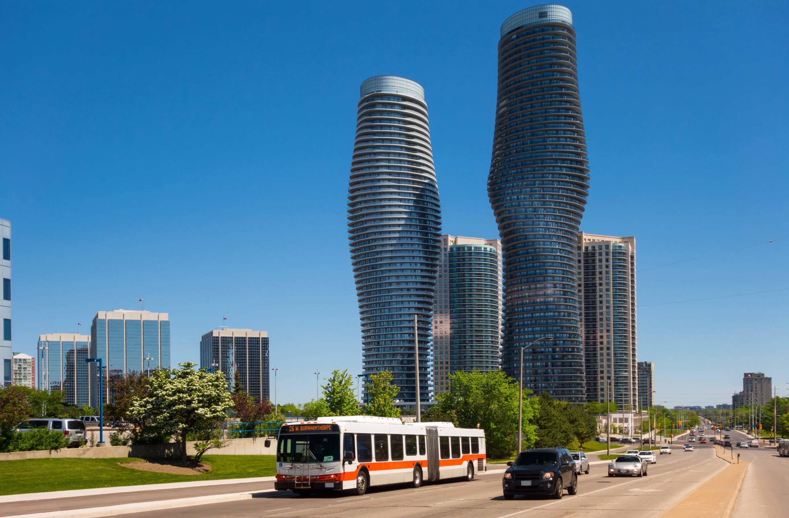 Burnhamthorpe Road running through downtown Mississauga, showcasing modern condos along the street.